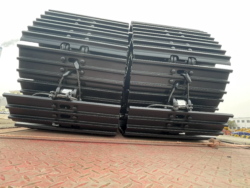 Finished steel track undercarriage assemblies prepared for shipment